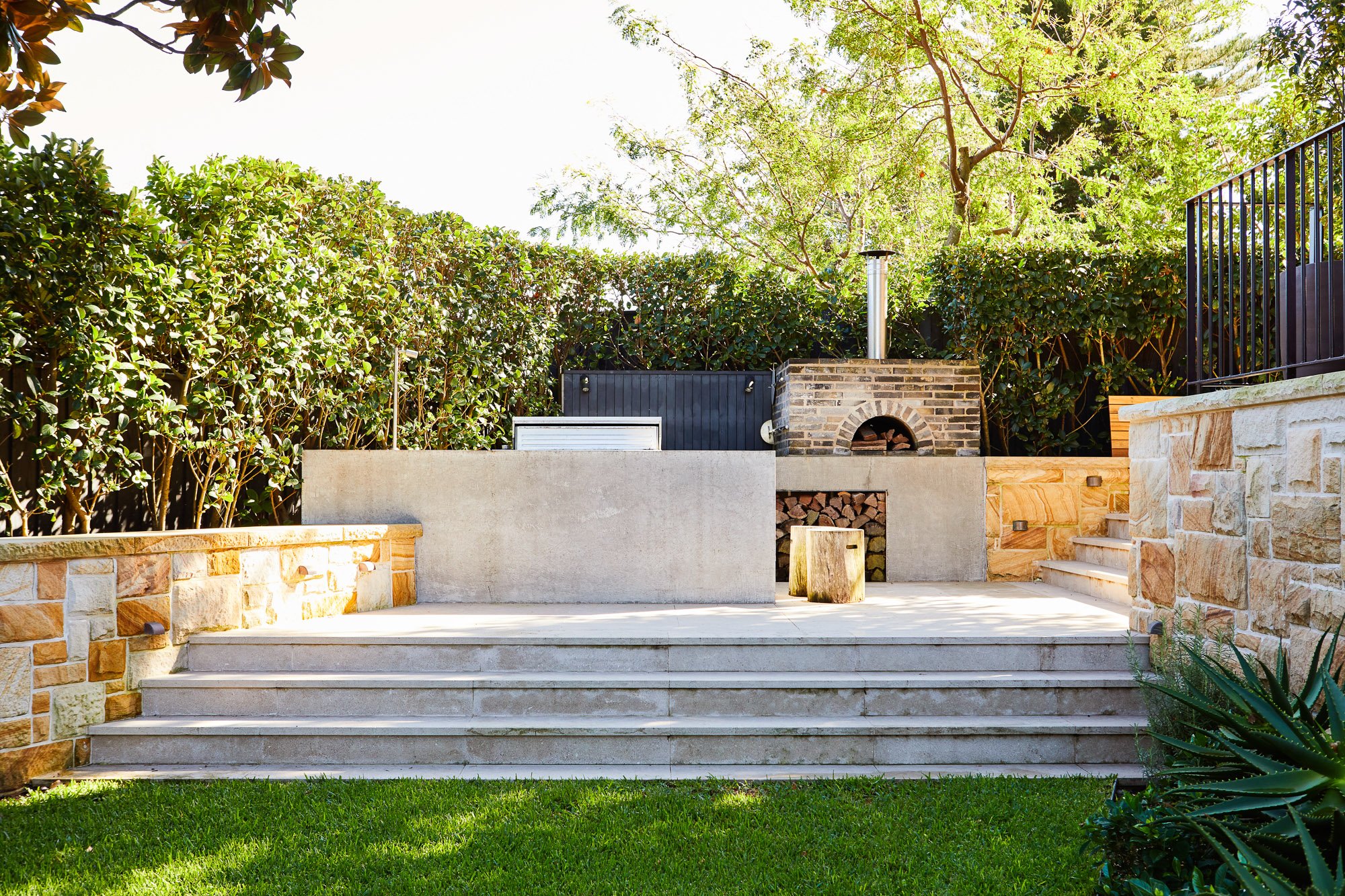 Concrete pool with green tile and Federation home backdrop, landscape architect Sydney